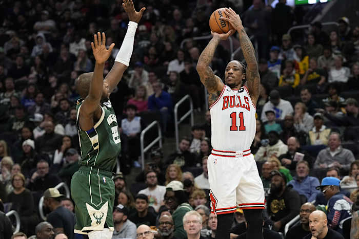 Chicago Bulls forward DeMar DeRozan (11) shoots against Milwaukee Bucks forward Khris Middleton (22) during the second quarter at Fiserv Forum.
